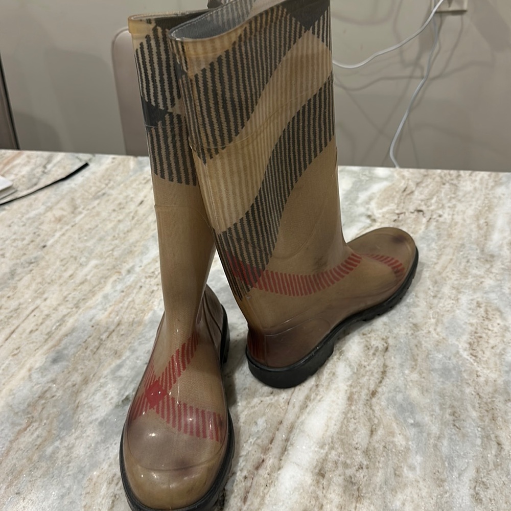 Worn Burberry rain boots.